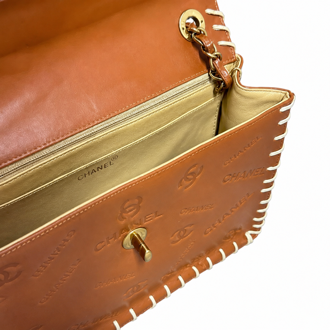 Chanel Large Flap Cognac CC Monogram Embossed | White Whipstitch & Gold Chain — 34cm