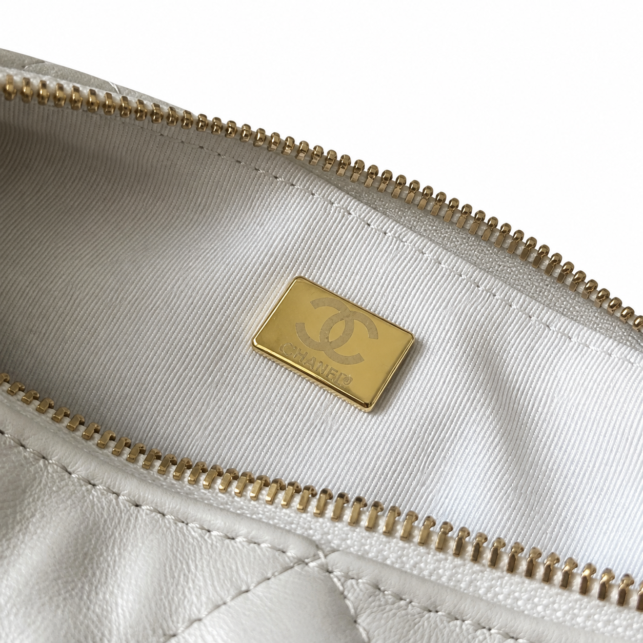 Chanel White Quilted Lambskin Hobo | Draped Gold Chain & Quilted Oval Charm — 26cm