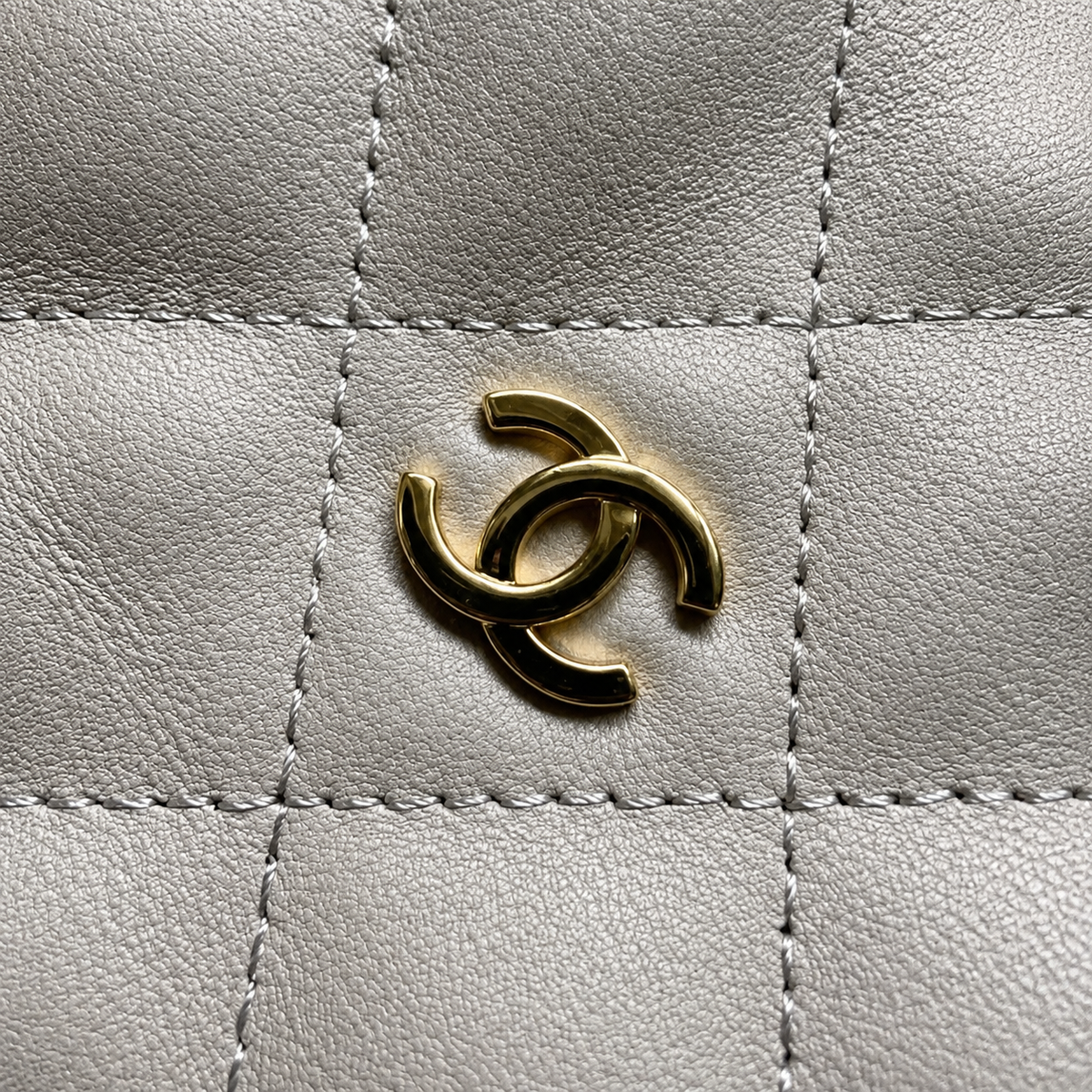 Chanel Ivory Lambskin Quilted Drawstring Bucket Bag | Gold CC Logo & CC Coin Charm Strap